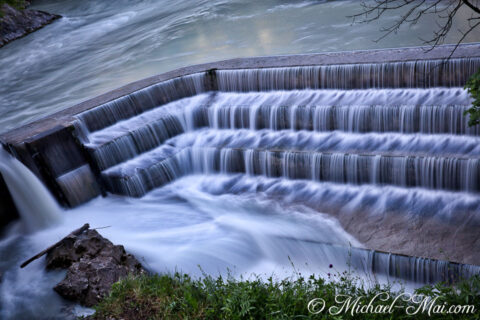 Long exposure photography transforms cascading water into a silky, ethereal flow.