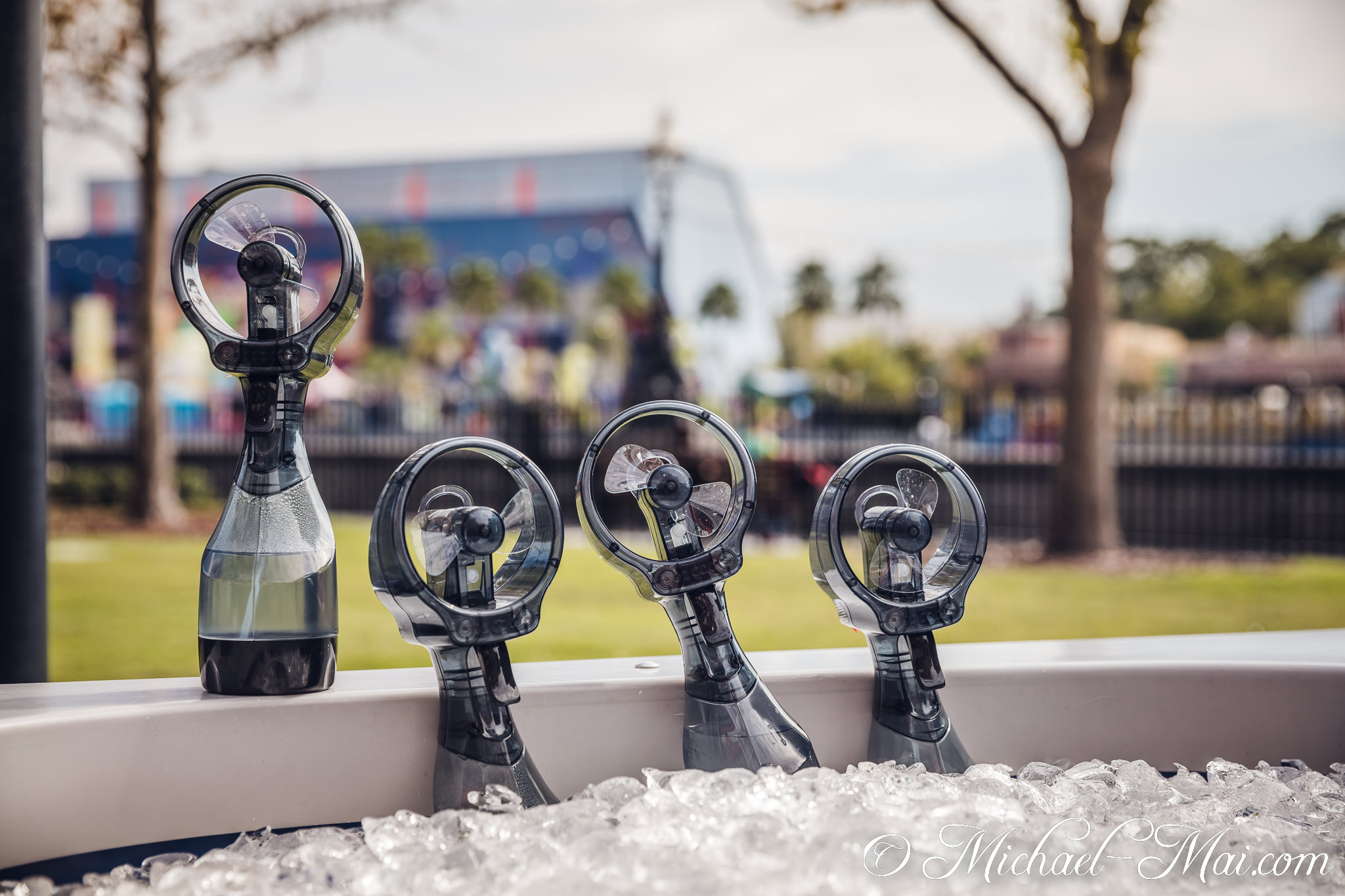 Refreshing misting fans, nestled in a bed of ice, combat the warm weather. | Orlando, Florida, United States