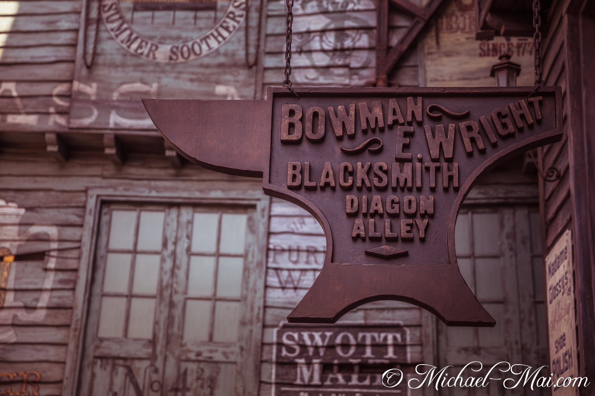 Prominent anvil-shaped sign proudly displays Bowman E. Wright Blacksmith of Diagon Alley. | Orlando, Florida, United States