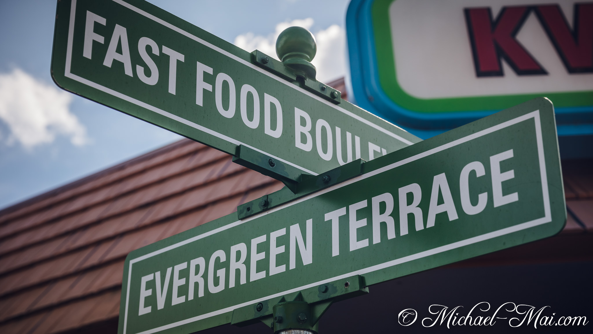 Intersecting green street signs point to "Fast Food Boulevard" and "Evergreen Terrace". | Orlando, Florida, United States