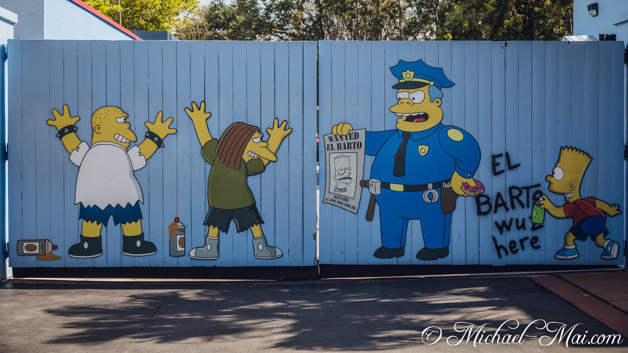 Chief Wiggum futilely hunts "El Barto" as Bart continues his graffiti artistry nearby. | Orlando, Florida, United States