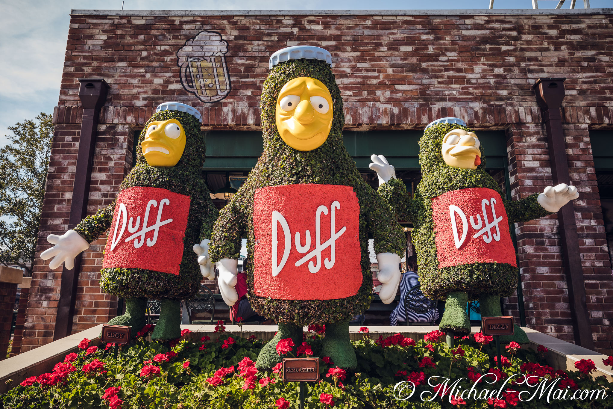 Distinct Duff Beer bottle topiaries showcase Edgy, Remorseful, and Dizzy's expressions. | Orlando, Florida, United States