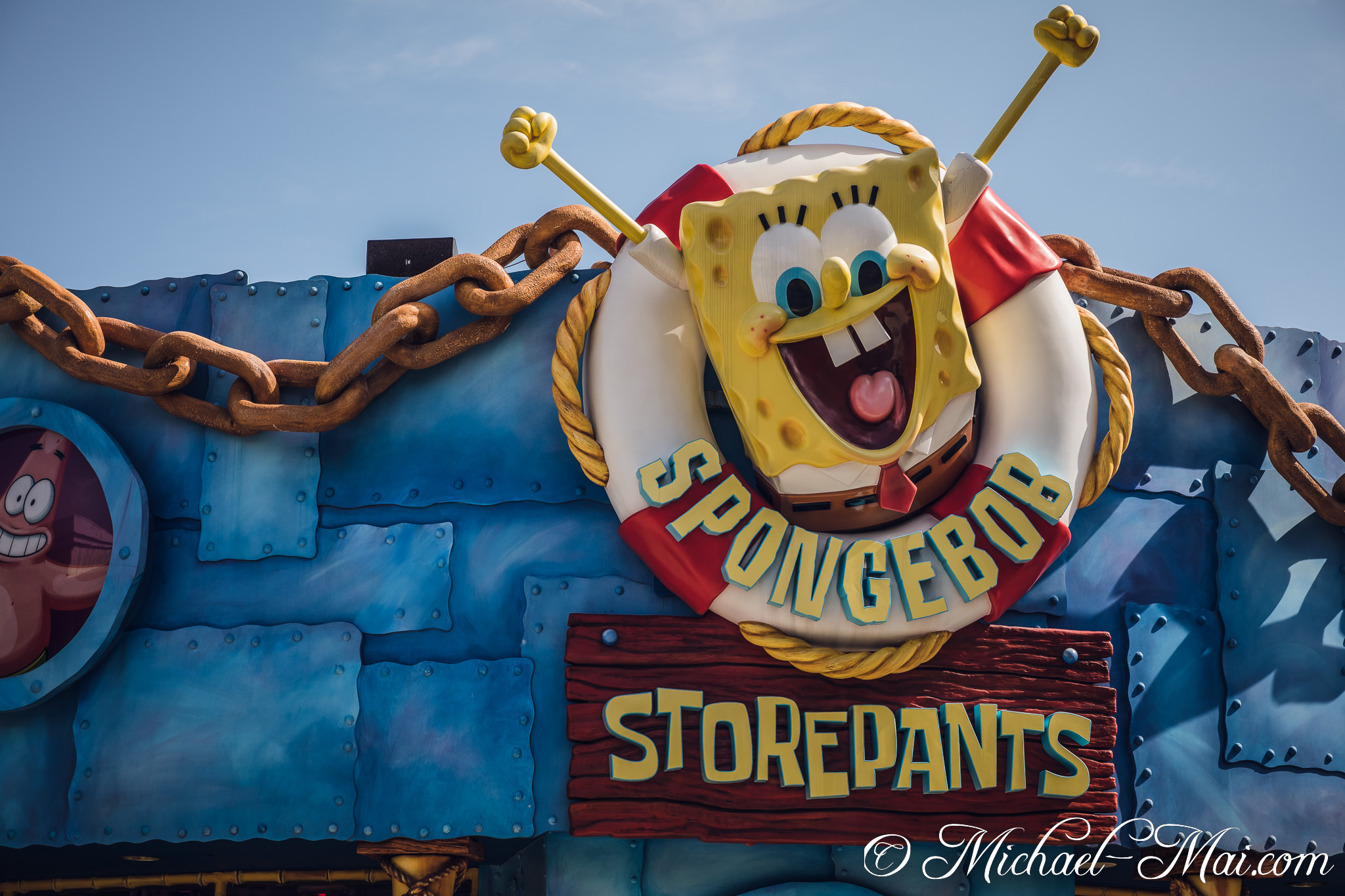 Spongebob's joyful expression and Patrick's peek animate the whimsical Storepants entrance. | Orlando, Florida, United States