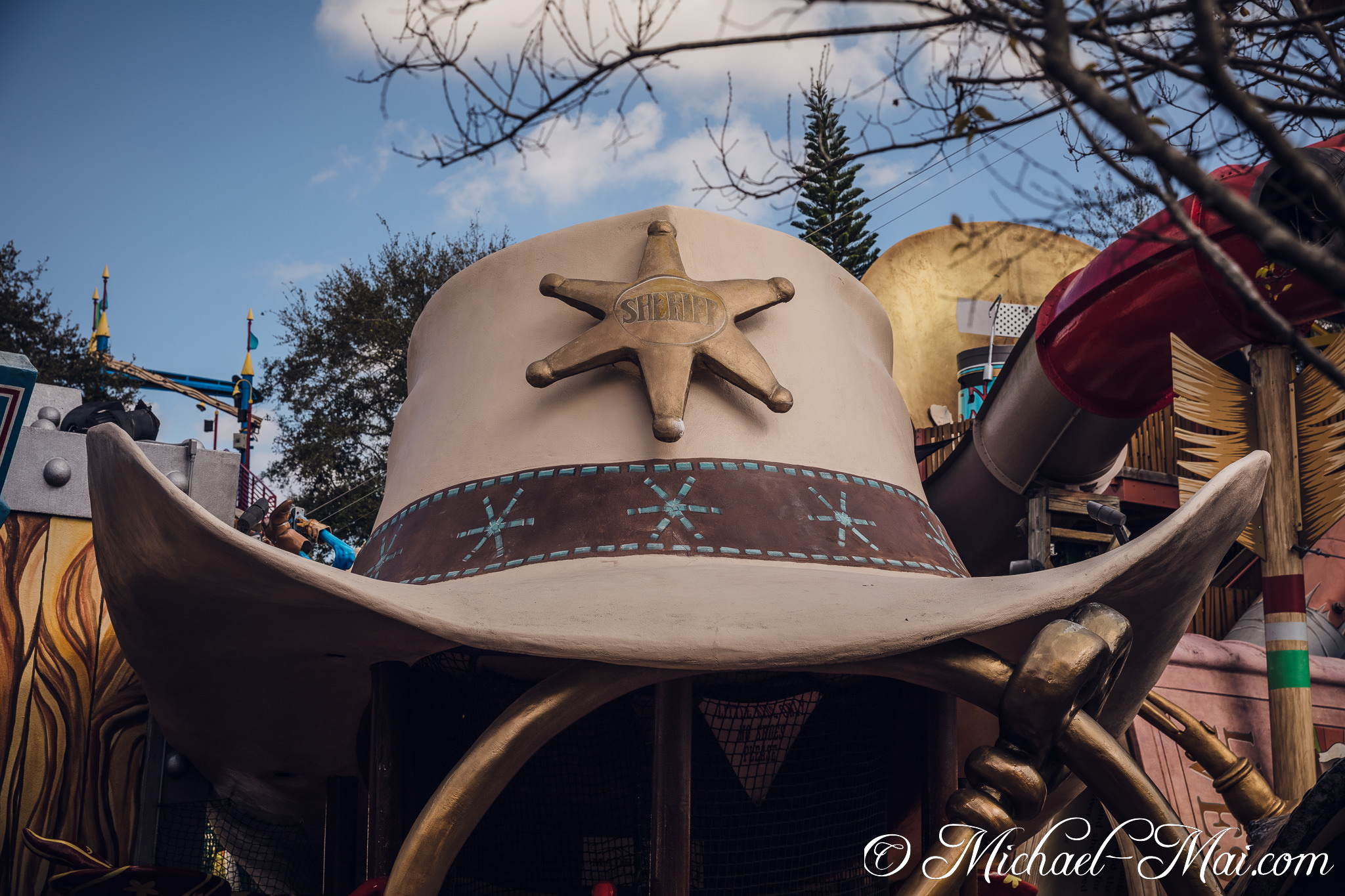 Towering sheriff hat invites adventurous play amidst a vibrant, imaginative landscape. | Orlando, Florida, United States