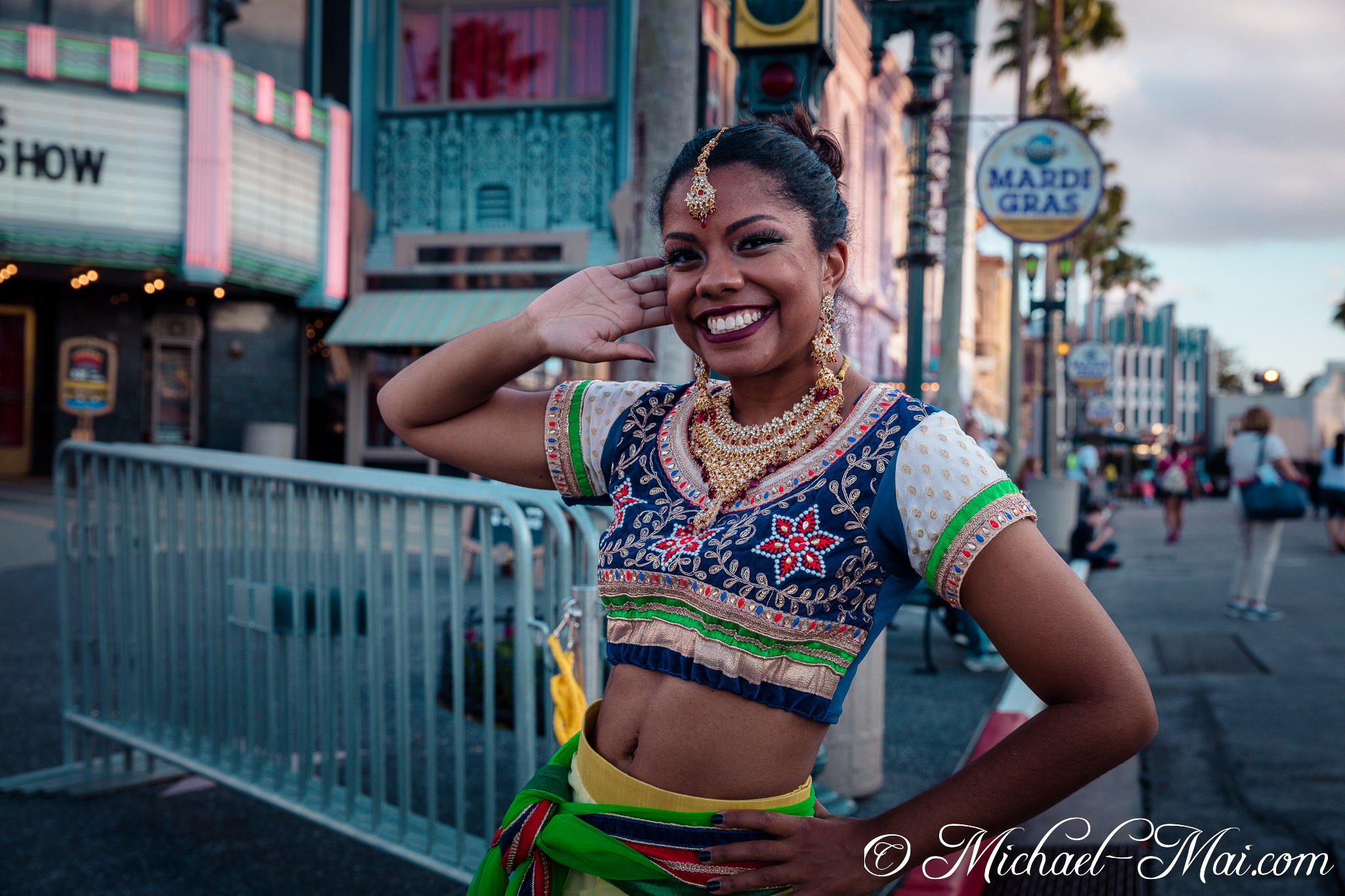 Ornate Indian costume and a beaming smile brightens the street festival. | Orlando, Florida, United States