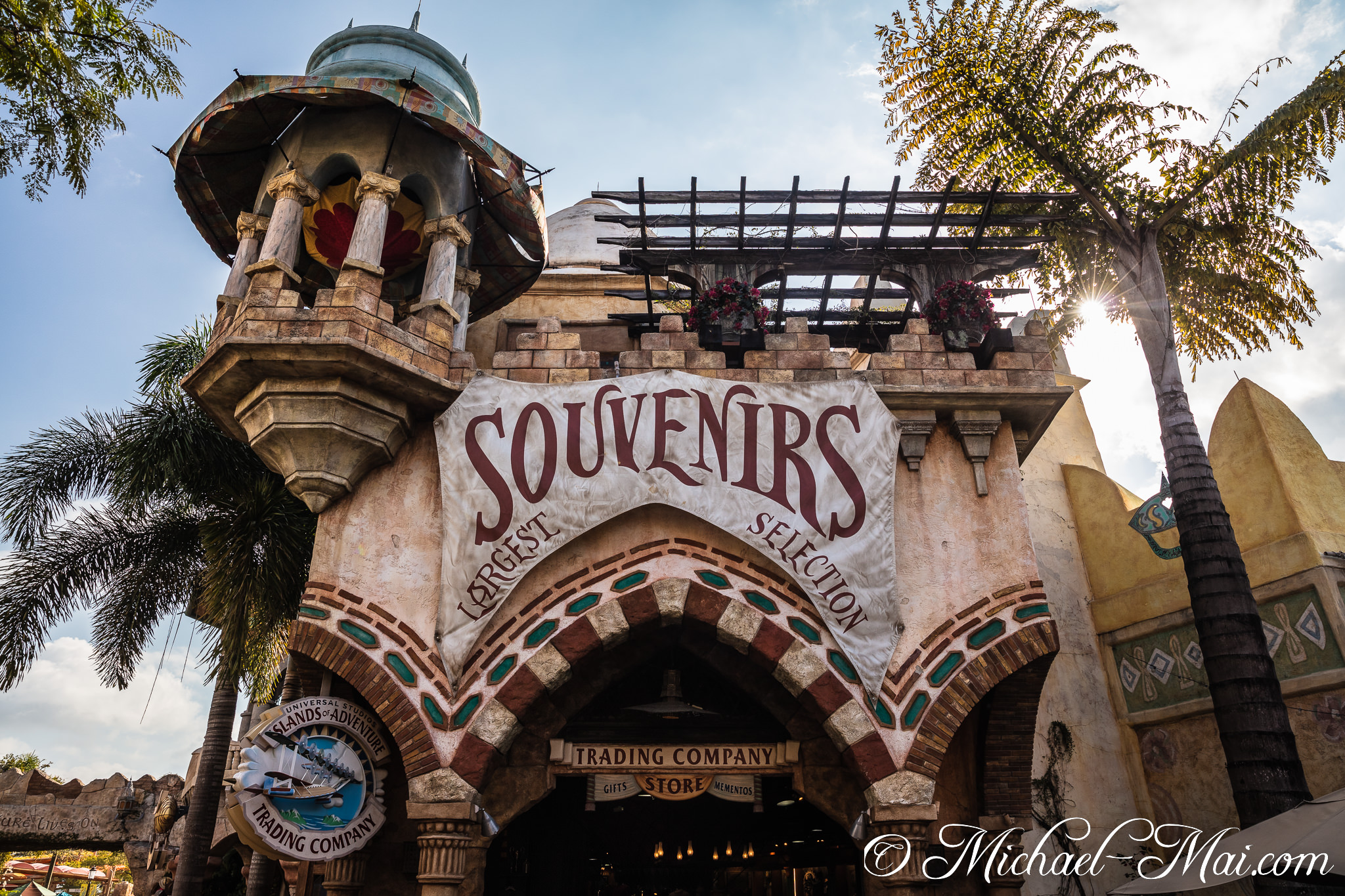 Universal's Islands of Adventure themed souvenir shop under a bright, tropical sun. | Orlando, Florida, United States