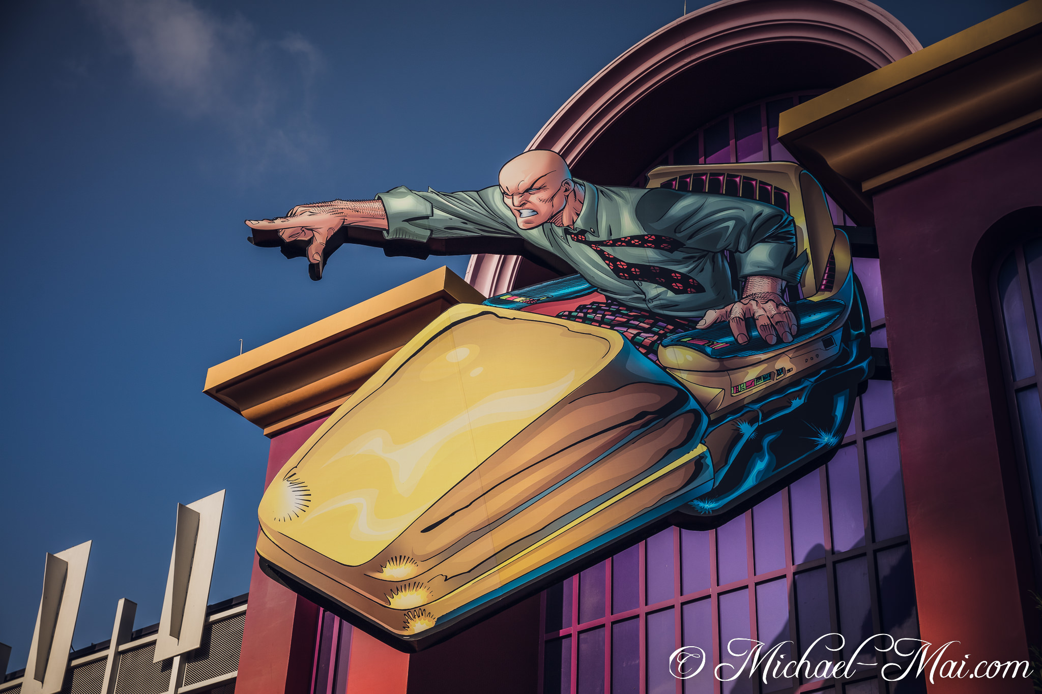 Lex Luthor's dynamic comic-style depiction blasts from a building in his iconic hovercraft. | Orlando, Florida, United States