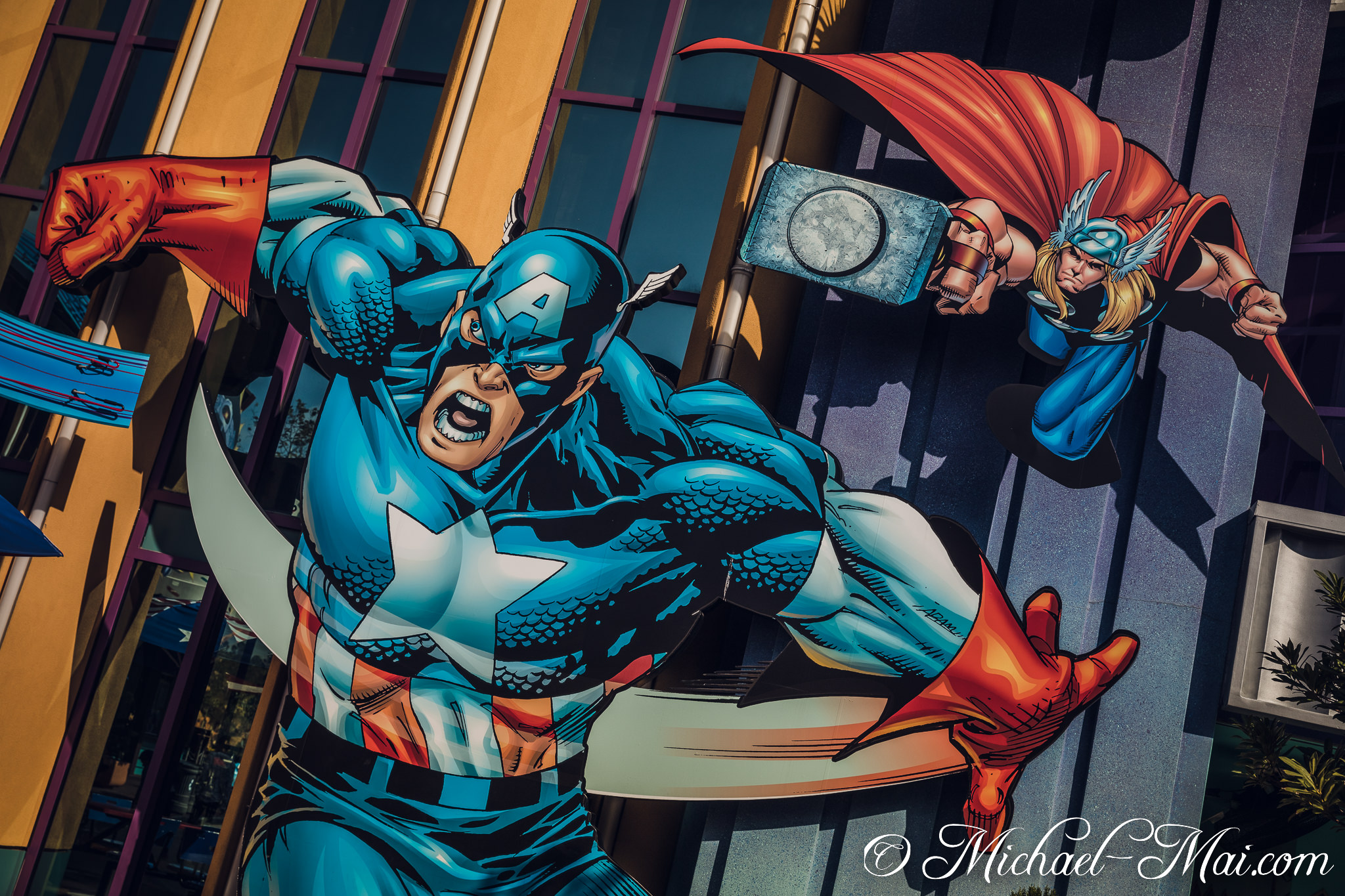 Iconic heroes Captain America and Thor explode in action on a building façade. | Orlando, Florida, United States
