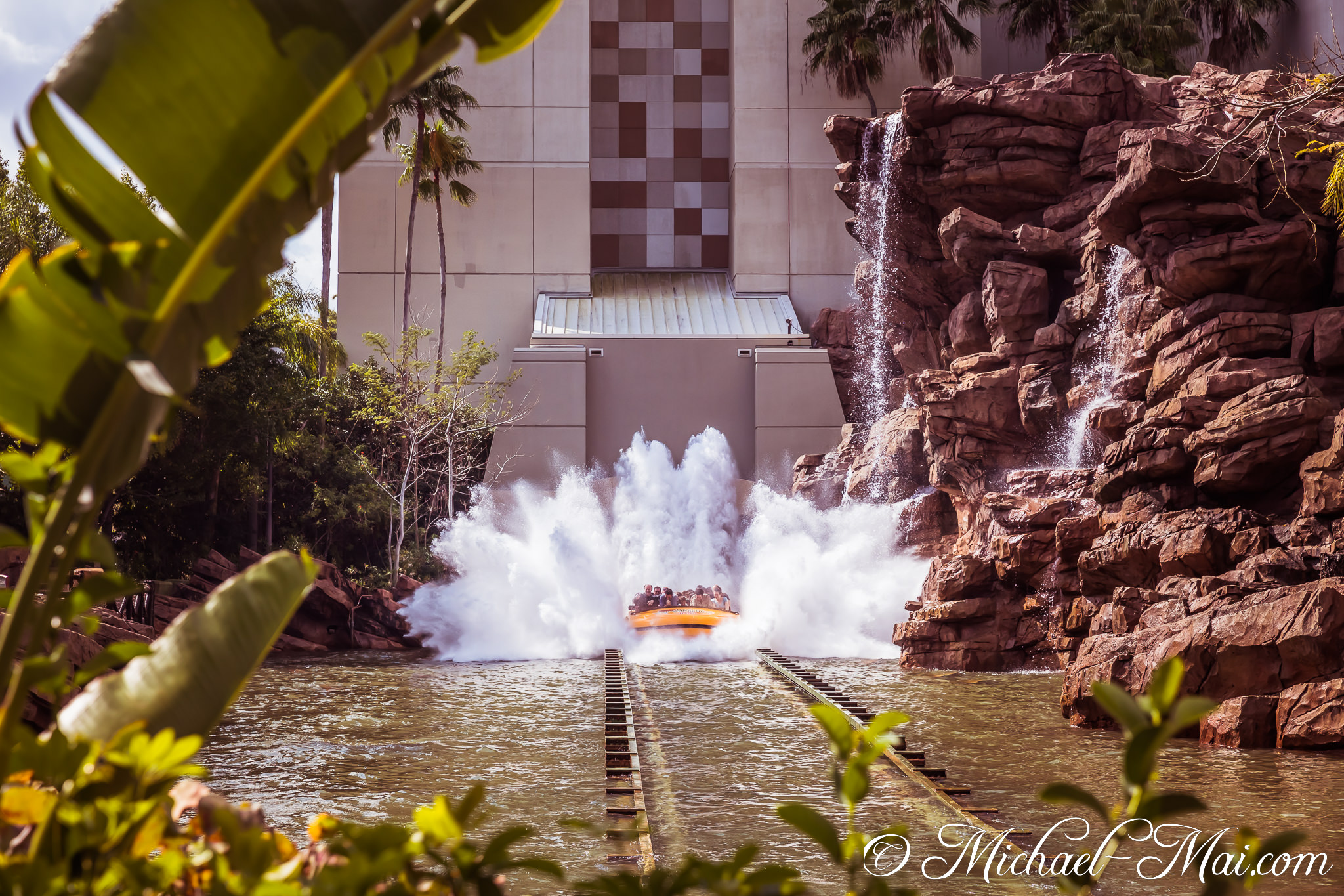 Powerful water erupts as a thrill ride plunges, soaking adventurers with refreshing spray. | Orlando, Florida, United States