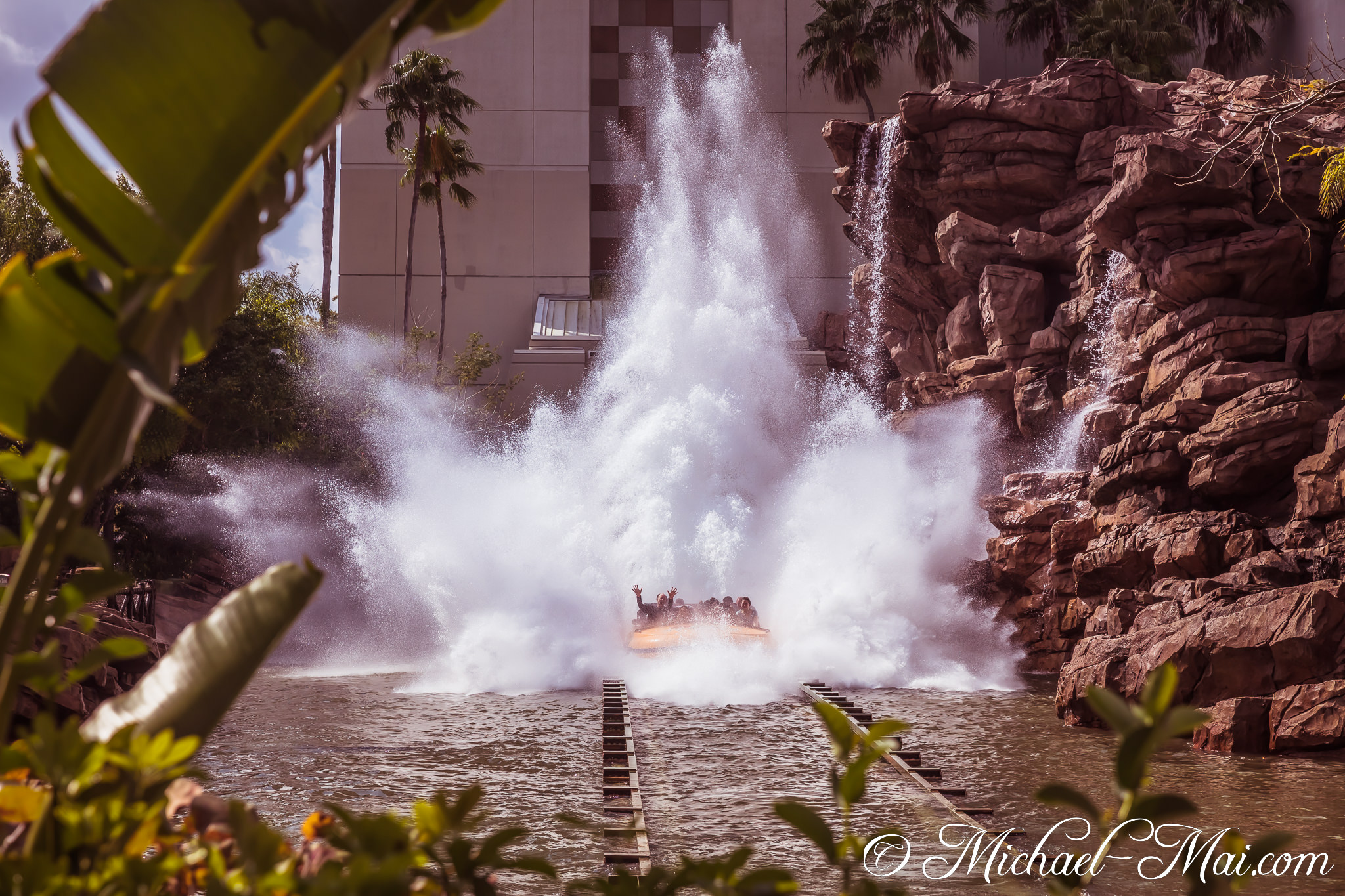 Dynamic plunge generates a colossal splash as riders cheer amidst tropical surroundings | Orlando, Florida, United States