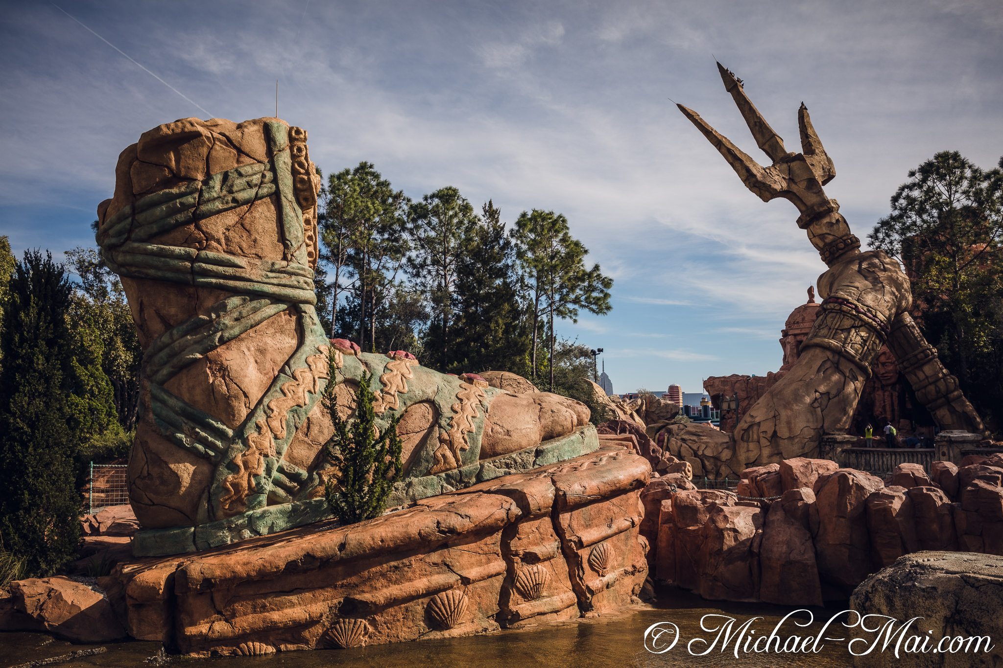 Weathered stone forms a massive foot and trident, remnants of a forgotten legend. | Orlando, Florida, United States